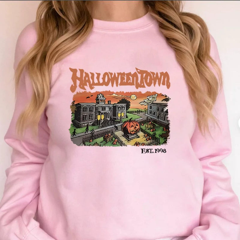 Pink sweatshirt with 'Halloweentown' graphic design on a plain background