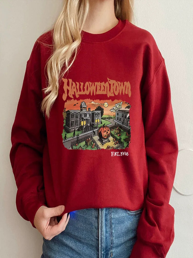 Red sweatshirt with 'Halloweentown' graphic design worn by a person against a plain background